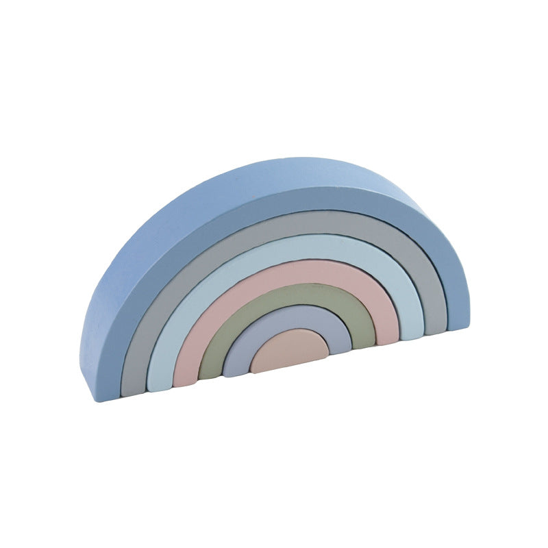 Pastel-colored rainbow-shaped object on a white background