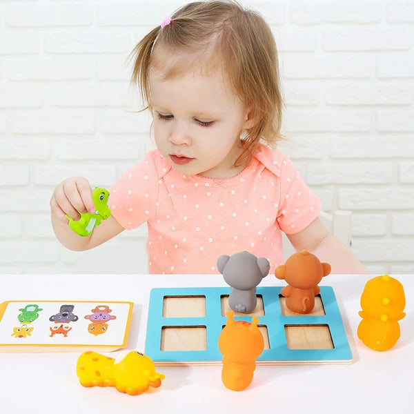 Child playing with educational toys on a white surface