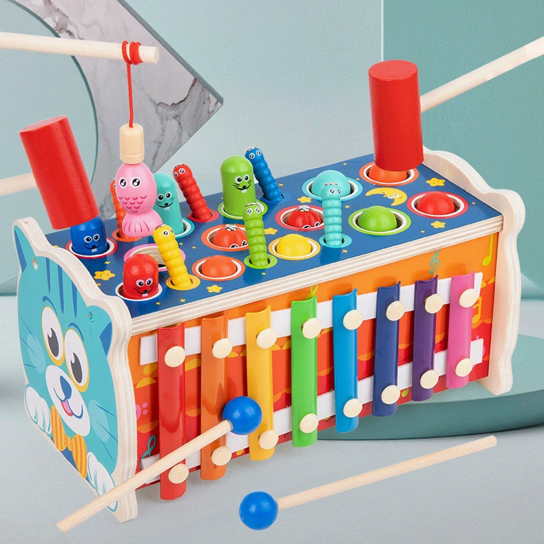 Colorful wooden toy with various interactive elements on a light blue background