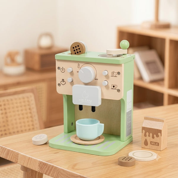 Toy coffee machine with a cup on a wooden table
