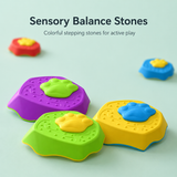 Colorful sensory balance stones with paw prints on a light green background