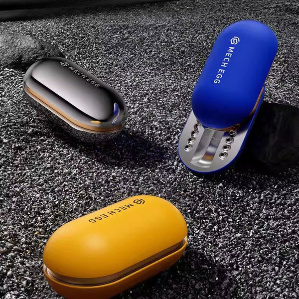 Three small devices in blue, yellow, and silver on a textured surface