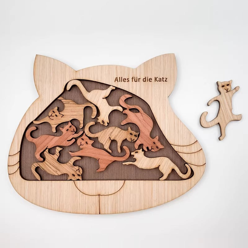 Wooden puzzle shaped like a cat with cut-out cat figures on a white background