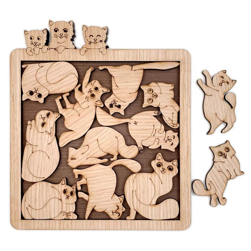 Wooden puzzle with cat shapes on a white background