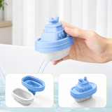 Hand holding a blue and white silicone boat-shaped container with additional images of the container on a light background.