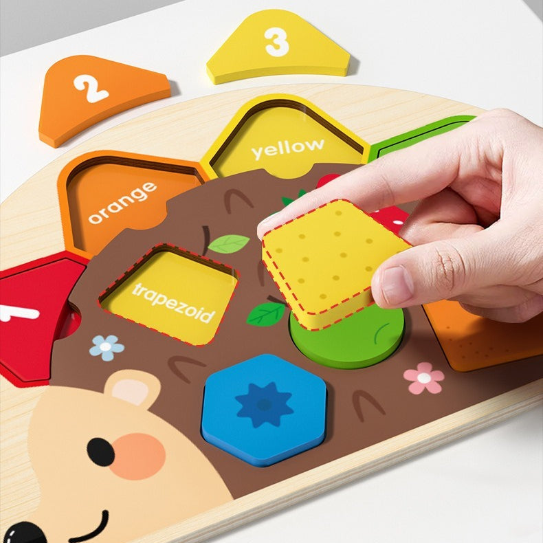 Wooden shape sorting puzzle with colorful shapes and a hand placing a yellow trapezoid piece.