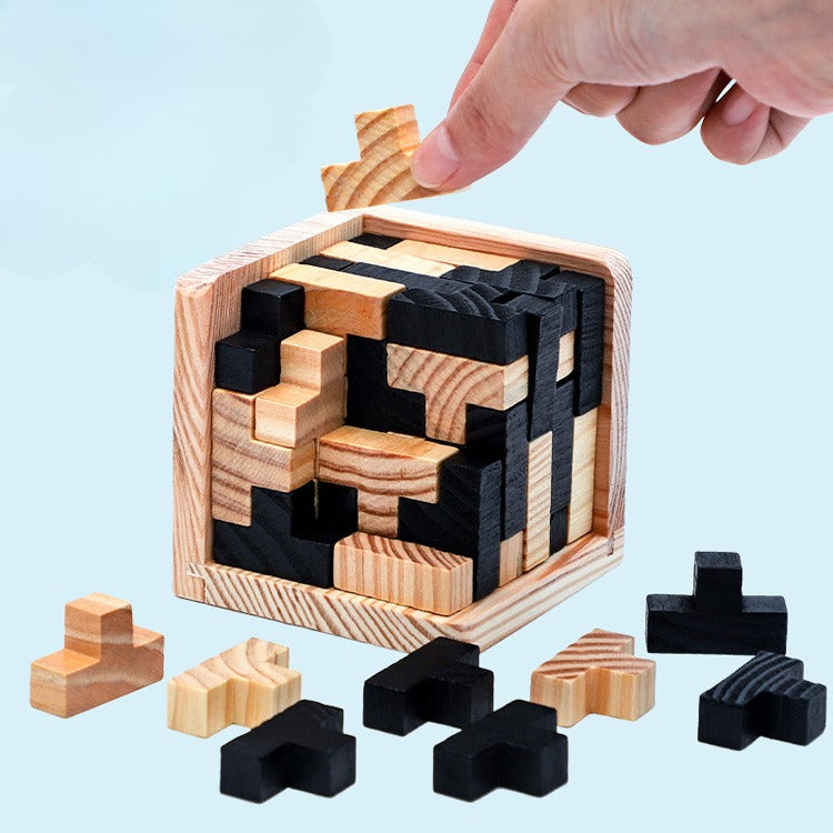Wooden puzzle with black and natural wood pieces on a light blue background