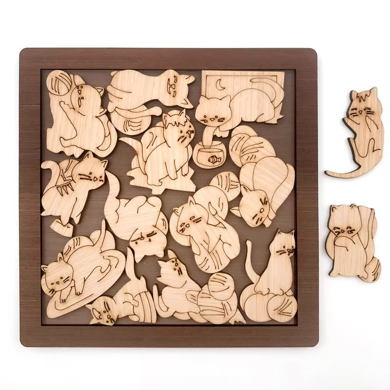 Wooden puzzle with cat shapes on a wooden tray