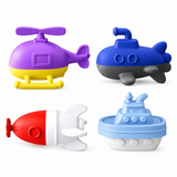Set of colorful toy vehicles including a purple helicopter, blue submarine, red and white rocket, and blue boat on a white background.