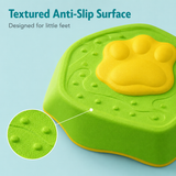 Green step stool with yellow paw design and textured surface on a light blue background