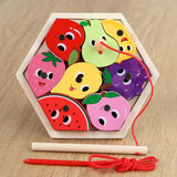 Colorful fruit-shaped wooden puzzle with a string on a wooden surface