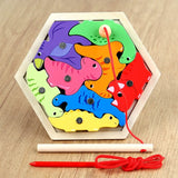 Colorful dinosaur wooden puzzle with a string on a wooden surface