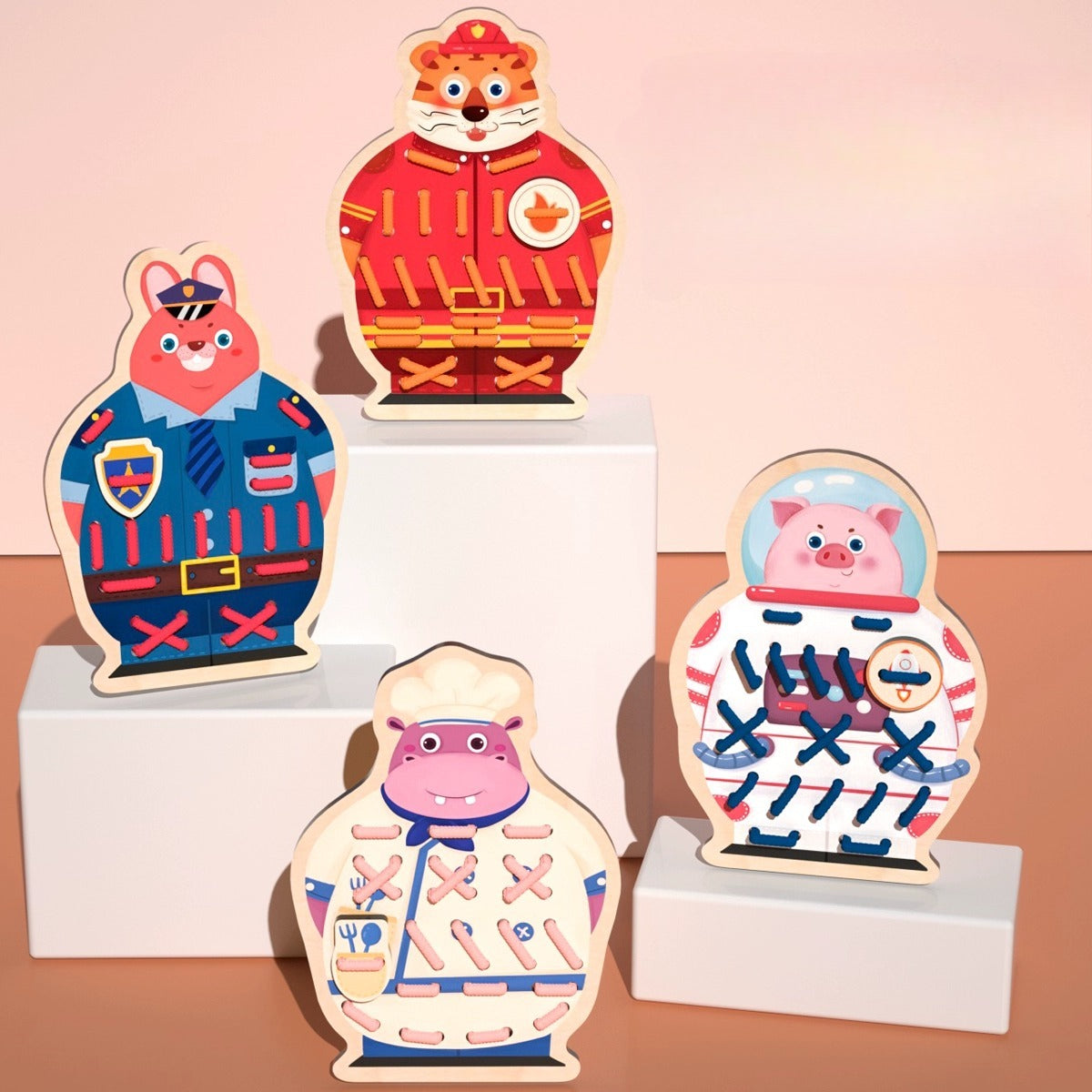 Set of colorful animal-themed wooden toys on a pink background