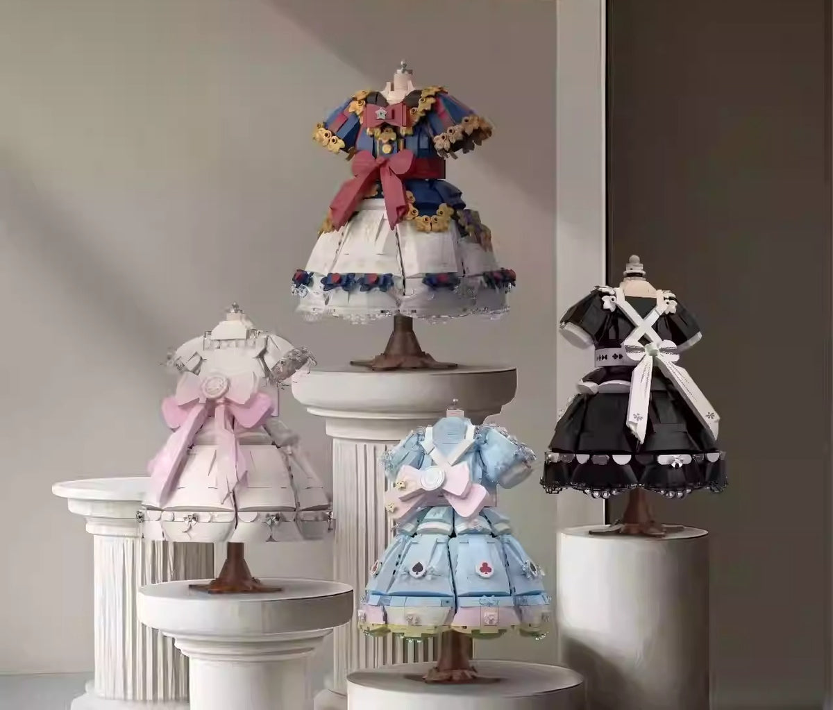 Lolita princess dress building block set laid out flat, showing all micro-block pieces in cream and pink ABS before assembly