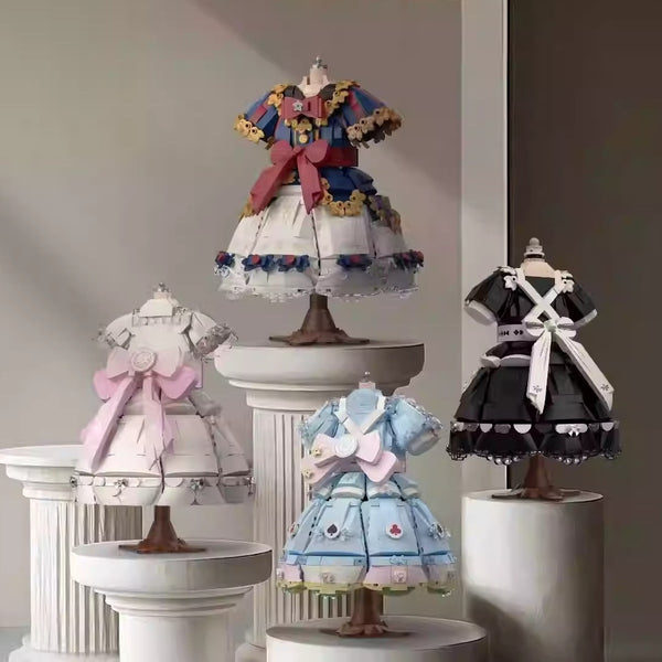 Lolita princess dress building block set laid out flat, showing all micro-block pieces in cream and pink ABS before assembly