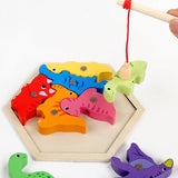 Wooden fishing game with colorful dinosaur-shaped hooks on a white background