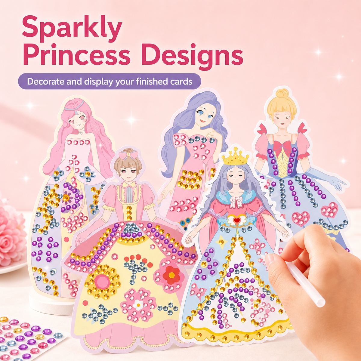 Sparkly princess designs with a hand holding a card, on a pink background