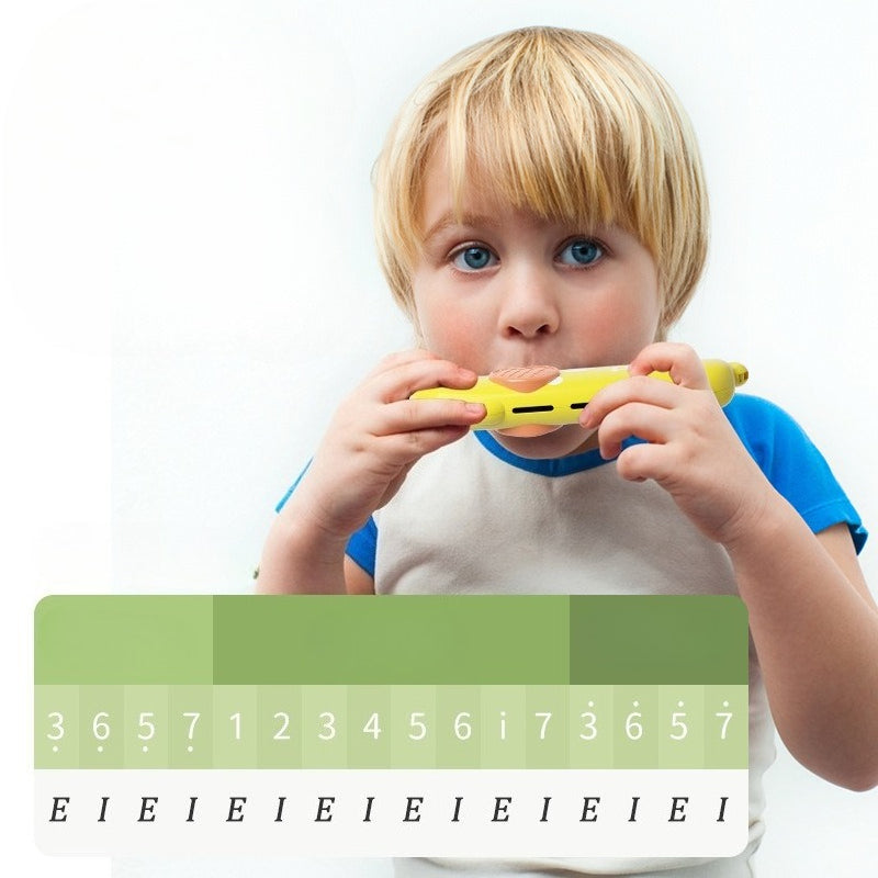 Child holding a yellow toy with musical notes and numbers on a white background