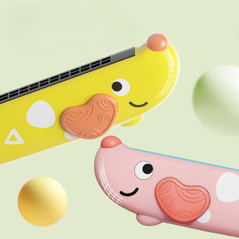 Two colorful toy figures, one yellow and one pink, on a light green background.