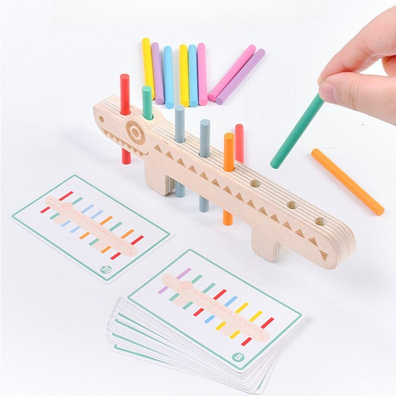 Wooden pegging game with colorful pegs and cards on a white background