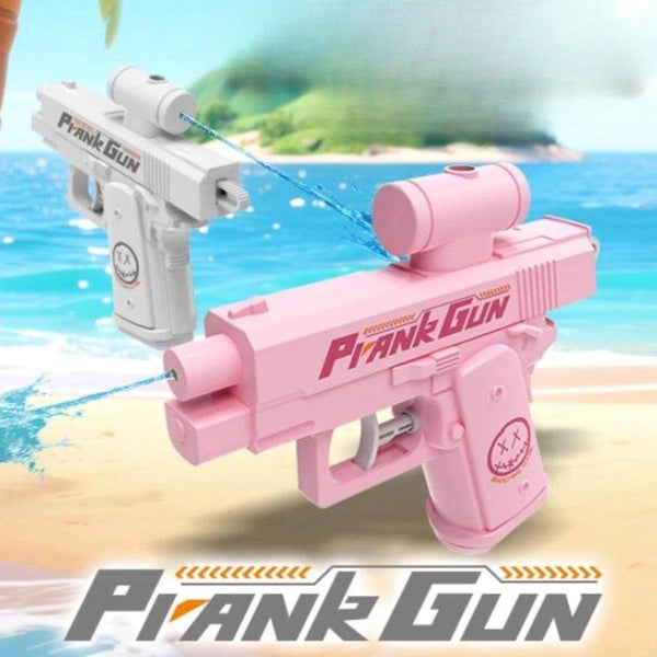 Pink and white 'Prank Gun' toys with a beach background