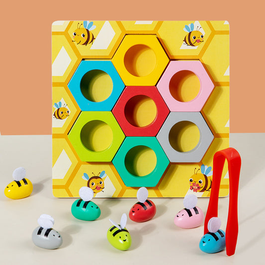 Colorful children's puzzle with hexagonal shapes and bee figures on a beige background