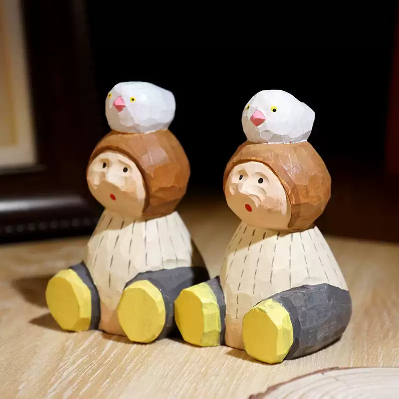 Hand-Carved Wooden Child with Bird Figurine FantastiKurios