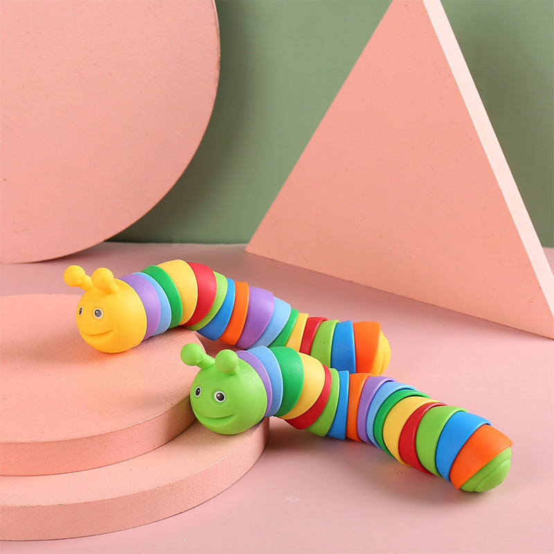 Colorful toy caterpillar on a geometric background