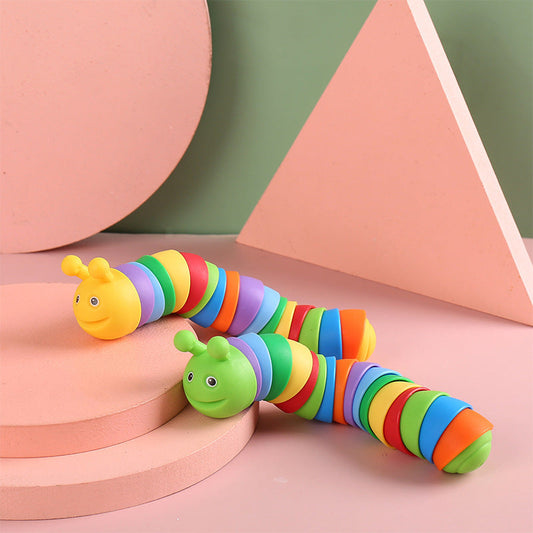 Colorful toy caterpillar on a geometric background