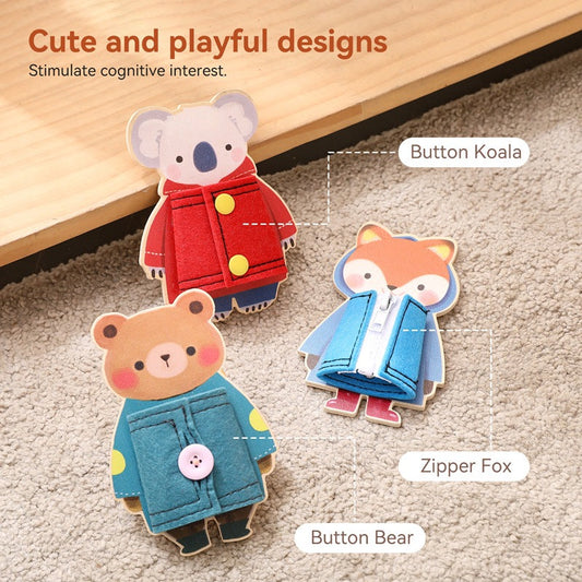 Three cute animal-themed buttons with colorful clothing on a textured surface.