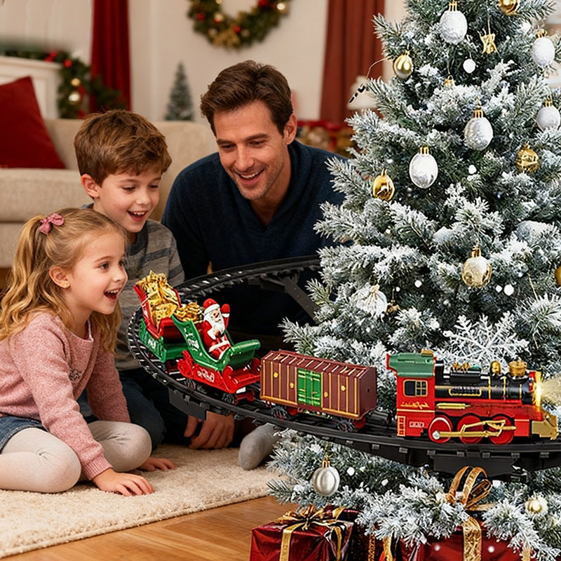 Man and two children playing with a Christmas train set in front of a decorated tree.