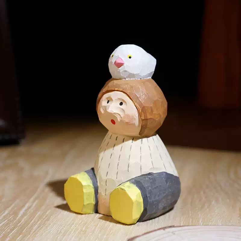 Hand-Carved Wooden Child with Bird Figurine FantastiKurios