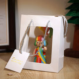 Hand-Carved Colorful Girl and Balloons Wooden Figurine FantastiKurios