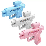 Three toy guns in blue, white, and pink on a white background