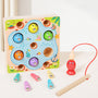 Wooden fishing game with colorful hooks and a magnetic fishing board on a white background