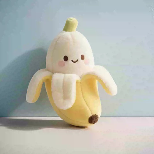 Plush toy shaped like a banana with a smiling face on a light blue background