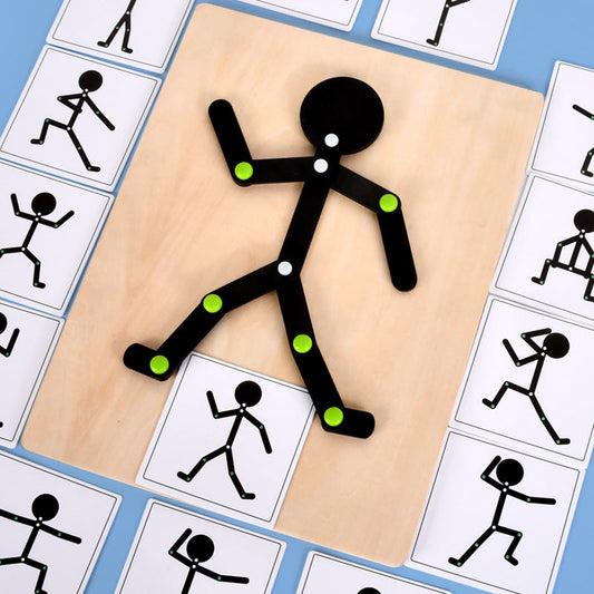 Black stick figure with green buttons on a beige board surrounded by white cards with black stick figures.