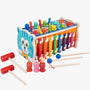 Colorful wooden toy with mallets and hanging characters on a white background