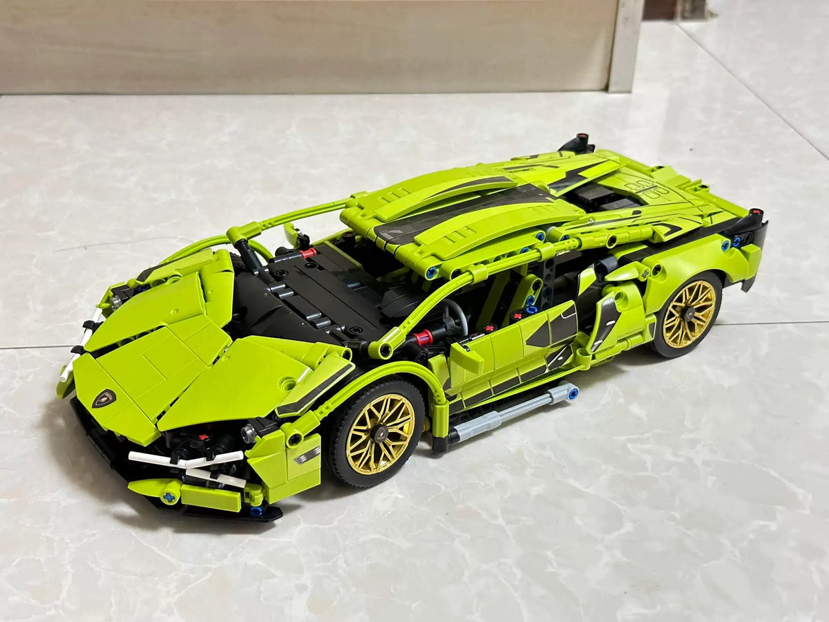 Toy model of a green sports car on a light gray surface