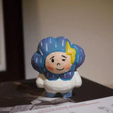 Hand-Carved Wooden Storm Boy Figurine FantastiKurios