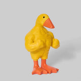 Three-step gift scene showing a funny duck figurine being unboxed, displayed, and gifted.