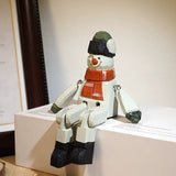 Hand-Painted Wooden Sitting Snowman Figurine with Jointed Legs FantastiKurios