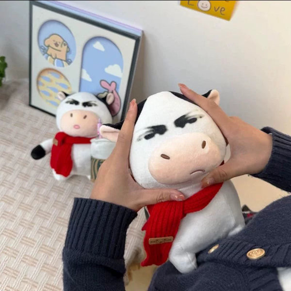 Skeptical Cow Plush Toy with Red Scarf