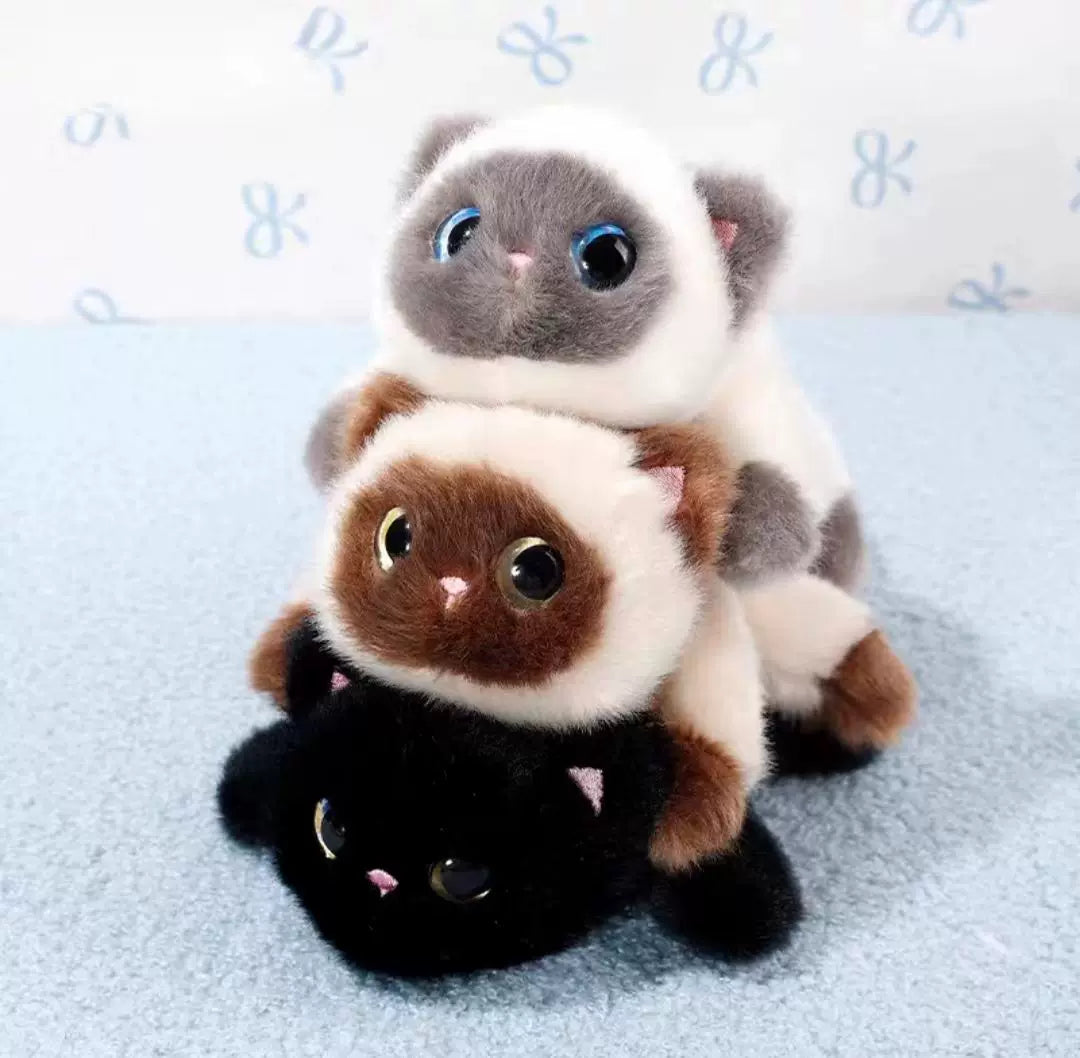 Three plush toys stacked on top of each other with a light blue background