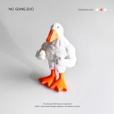 Novelty duck figurine displayed on a desk with books and home office decor.