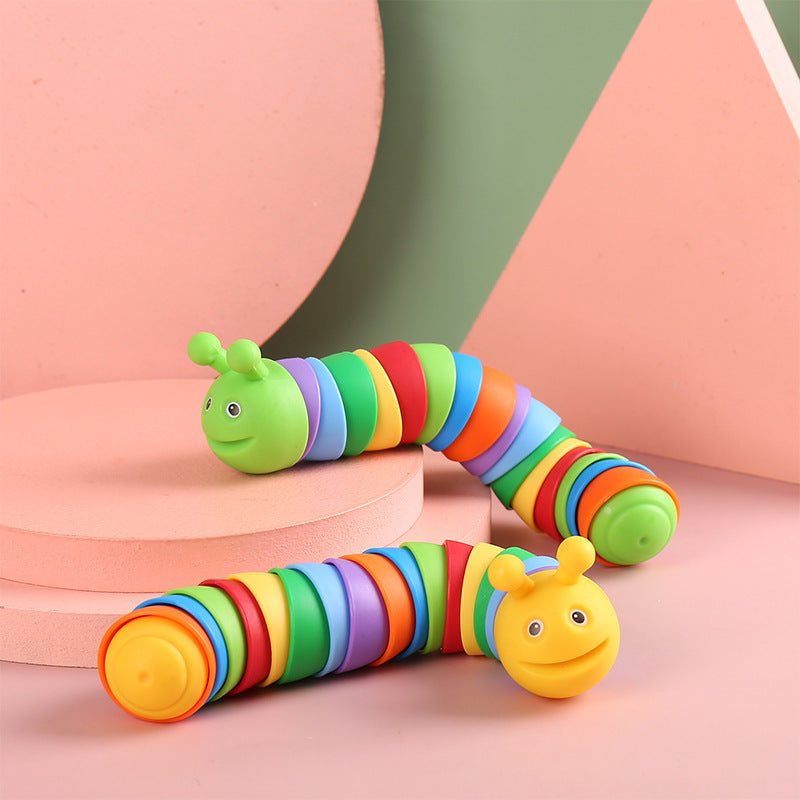Colorful caterpillar toy on a pastel background