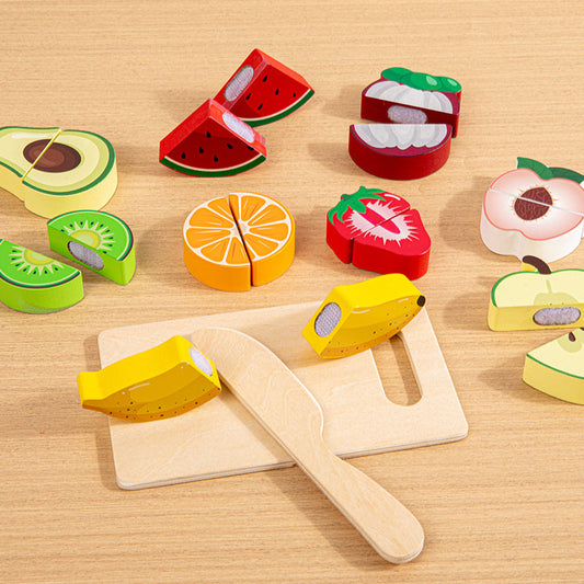Wooden toy fruits and vegetables set on a wooden surface