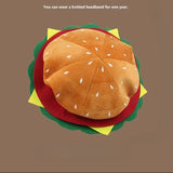 Hamburger-shaped knitted headband on a brown background with 'FRECA' branding.