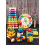 Assorted colorful wooden toys on a dark surface with a wooden background