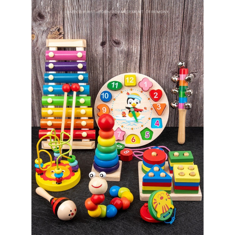 Assorted colorful wooden toys on a dark surface with a wooden background